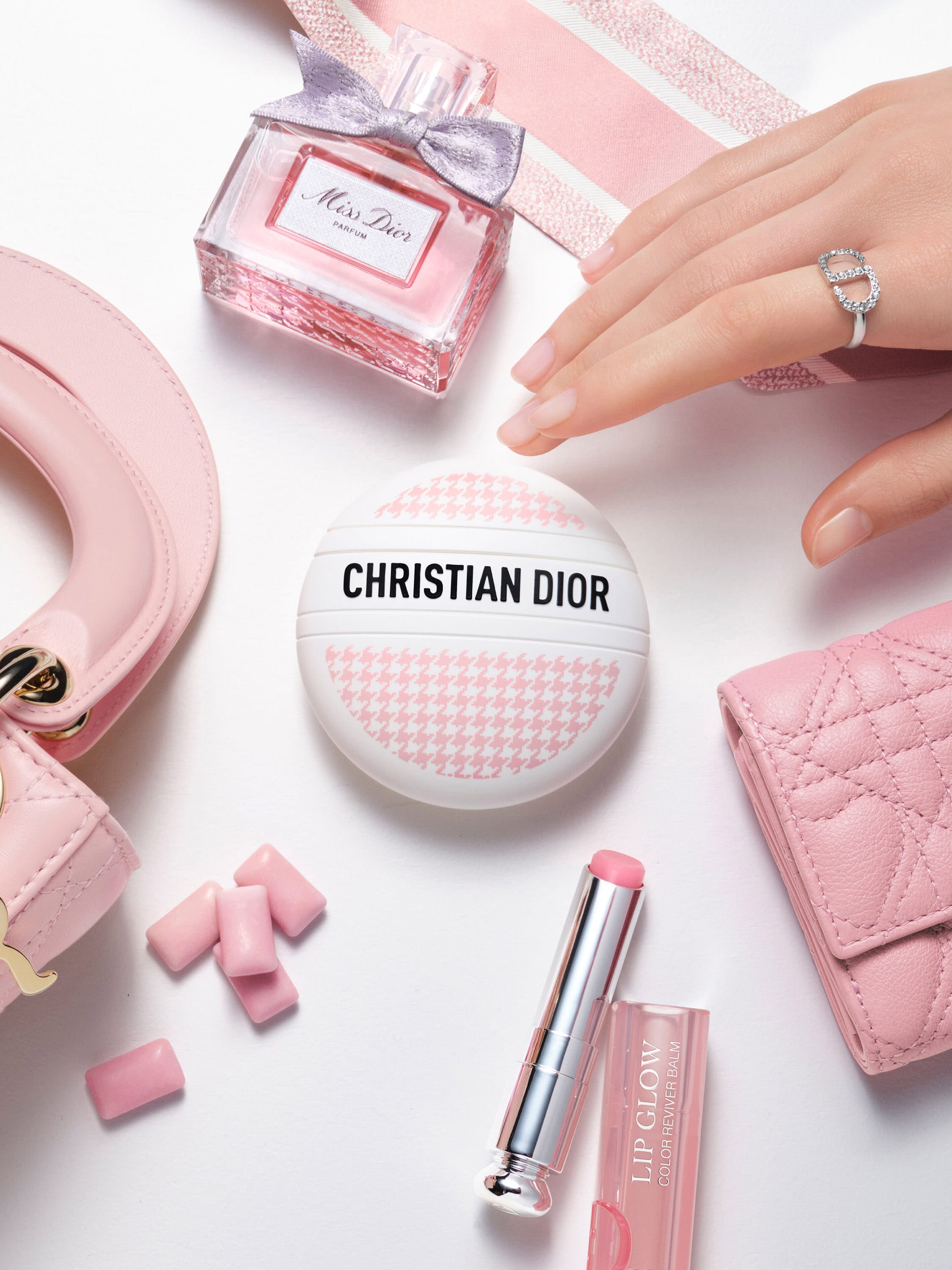 A photo with a neutral background of the multi-purpose balm and the limited edition Dior Le Baume.